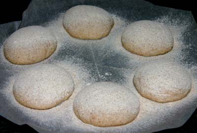 Close-up of the first batch of rolls before
                baking