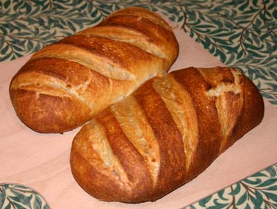 The loaves that were sprayed with water before and during baking